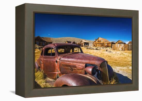 Rusted car and buildings, Bodie State Historic Park, California, USA-Russ Bishop-Framed Premier Image Canvas