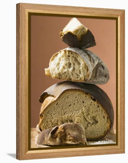 Rustic Bread, Two Loaves with Pieces Cut Off in a Pile-null-Framed Premier Image Canvas