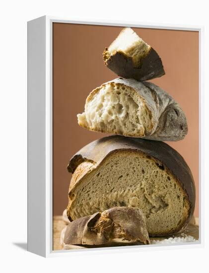 Rustic Bread, Two Loaves with Pieces Cut Off in a Pile-null-Framed Premier Image Canvas