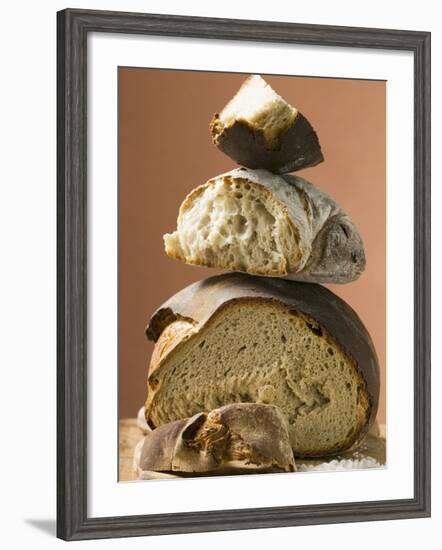 Rustic Bread, Two Loaves with Pieces Cut Off in a Pile-null-Framed Photographic Print