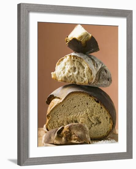 Rustic Bread, Two Loaves with Pieces Cut Off in a Pile-null-Framed Photographic Print