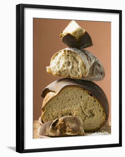 Rustic Bread, Two Loaves with Pieces Cut Off in a Pile-null-Framed Photographic Print