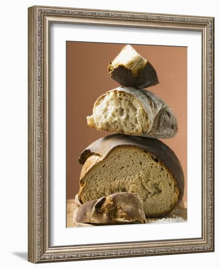 Rustic Bread, Two Loaves with Pieces Cut Off in a Pile-null-Framed Photographic Print