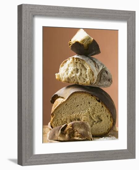 Rustic Bread, Two Loaves with Pieces Cut Off in a Pile-null-Framed Photographic Print