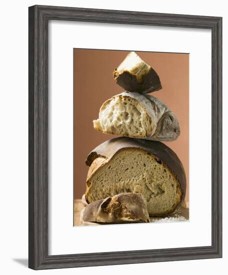 Rustic Bread, Two Loaves with Pieces Cut Off in a Pile-null-Framed Photographic Print