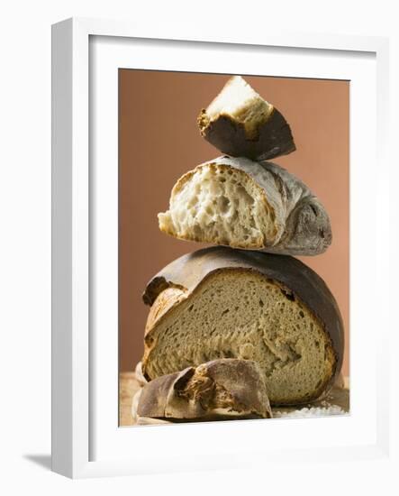 Rustic Bread, Two Loaves with Pieces Cut Off in a Pile-null-Framed Photographic Print