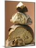 Rustic Bread, Two Loaves with Pieces Cut Off in a Pile-null-Mounted Photographic Print