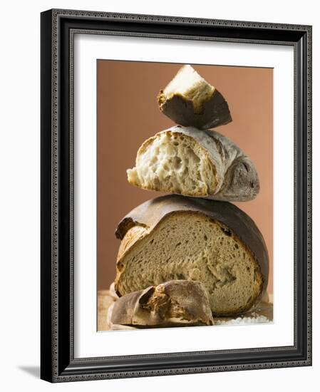 Rustic Bread, Two Loaves with Pieces Cut Off in a Pile-null-Framed Photographic Print