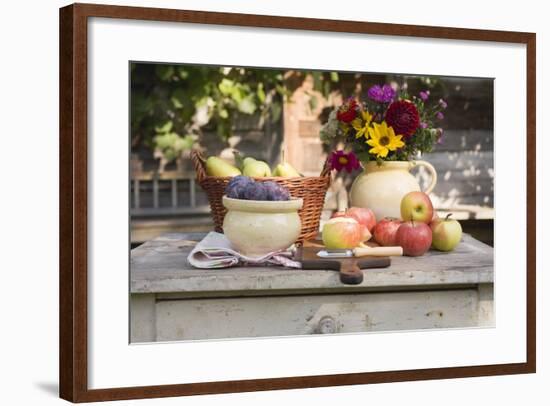 Rustic Fruit Still Life on Garden Table in Front of Farmhouse-Foodcollection-Framed Photographic Print