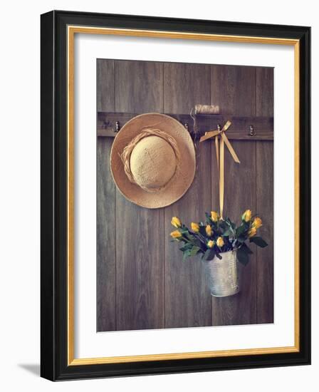 Rustic Shed Door with Hanging Straw Hat and Bucket of Yellow Roses-Chris_Elwell-Framed Photographic Print