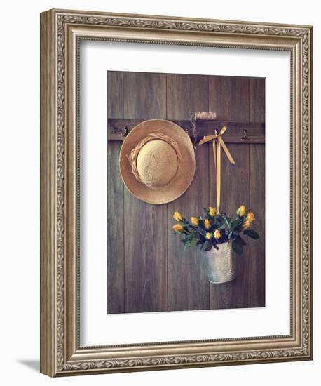 Rustic Shed Door with Hanging Straw Hat and Bucket of Yellow Roses-Chris_Elwell-Framed Photographic Print