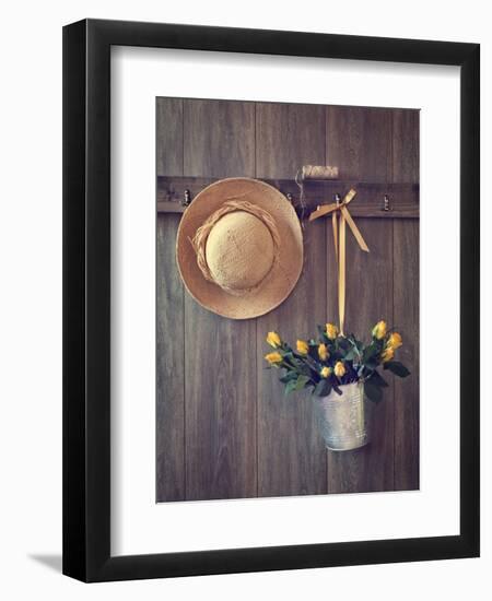 Rustic Shed Door with Hanging Straw Hat and Bucket of Yellow Roses-Chris_Elwell-Framed Photographic Print