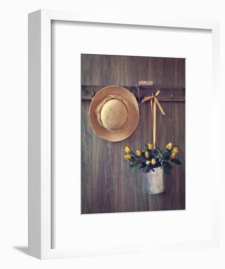 Rustic Shed Door with Hanging Straw Hat and Bucket of Yellow Roses-Chris_Elwell-Framed Photographic Print