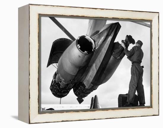 SAC's Maintenance Mechanic Sliding Into Barrel of Bomber's Jet Engine with the Help of His Partner-Margaret Bourke-White-Framed Premier Image Canvas