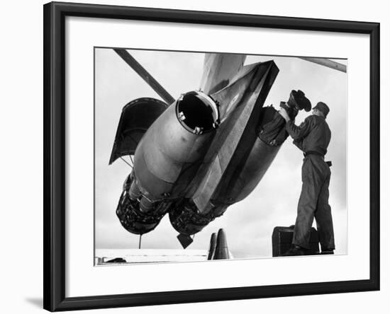 SAC's Maintenance Mechanic Sliding Into Barrel of Bomber's Jet Engine with the Help of His Partner-Margaret Bourke-White-Framed Photographic Print