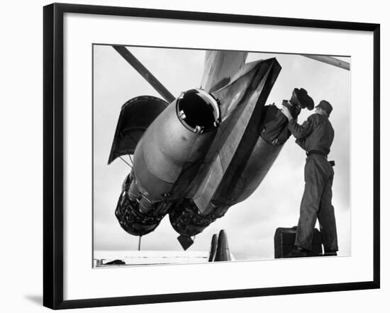 SAC's Maintenance Mechanic Sliding Into Barrel of Bomber's Jet Engine with the Help of His Partner-Margaret Bourke-White-Framed Photographic Print