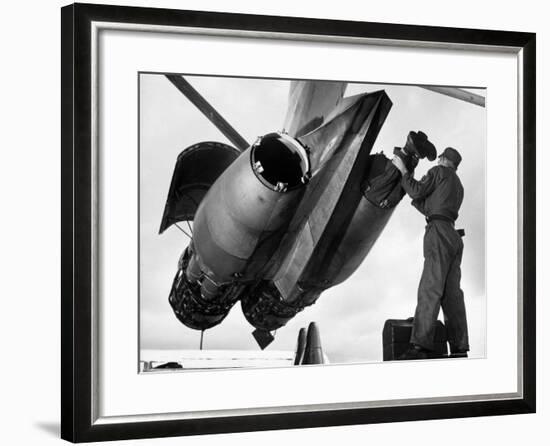 SAC's Maintenance Mechanic Sliding Into Barrel of Bomber's Jet Engine with the Help of His Partner-Margaret Bourke-White-Framed Photographic Print