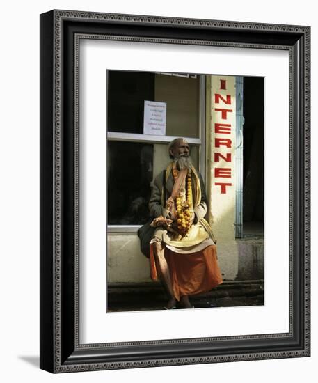 Sadhu Sitting Outside an Internet Cafe, Varanasi, Uttar Pradesh State, India-James Gritz-Framed Photographic Print