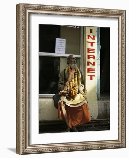 Sadhu Sitting Outside an Internet Cafe, Varanasi, Uttar Pradesh State, India-James Gritz-Framed Photographic Print