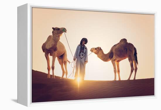 Sahara Desert, Morocco. Silhouette on the Dunes at Sunset.-Marco Bottigelli-Framed Premier Image Canvas