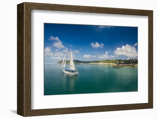 Sailing boat anchoring on Mana Island, Mamanuca Islands, Fiji, South Pacific-Michael Runkel-Framed Photographic Print