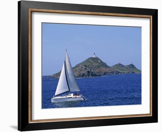 Sailing Boat with the Semaphore Lighthouse Behind, Iles Sanguinaires, Island of Corsica, France-Thouvenin Guy-Framed Photographic Print