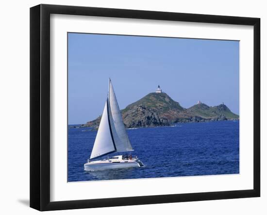 Sailing Boat with the Semaphore Lighthouse Behind, Iles Sanguinaires, Island of Corsica, France-Thouvenin Guy-Framed Photographic Print