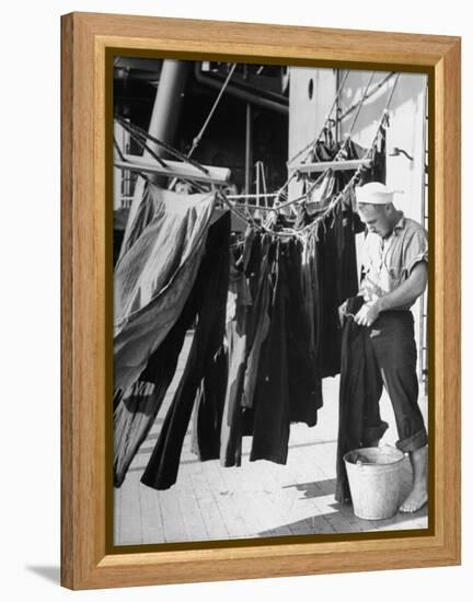 Sailor Aboard a Us Navy Cruiser at Sea Hanging Up Laundered Dungarees During WWII-Ralph Morse-Framed Premier Image Canvas