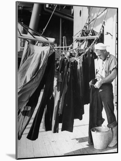 Sailor Aboard a Us Navy Cruiser at Sea Hanging Up Laundered Dungarees During WWII-Ralph Morse-Mounted Photographic Print