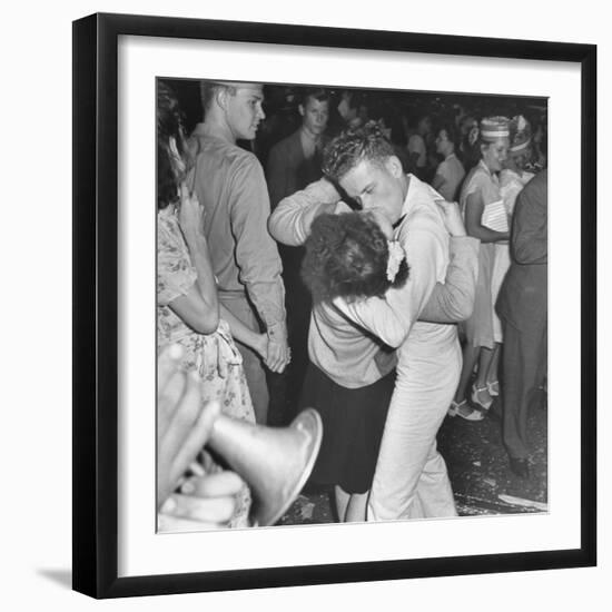 Sailor Kissing Pretty Girl amidst Jubilant Crowd in Celebration Regarding the End of WWII-Gordon Coster-Framed Photographic Print