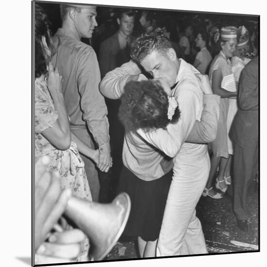 Sailor Kissing Pretty Girl amidst Jubilant Crowd in Celebration Regarding the End of WWII-Gordon Coster-Mounted Photographic Print