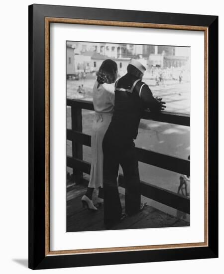 Sailor on Shore Leave Standing on Pier with a Young Woman-Peter Stackpole-Framed Photographic Print