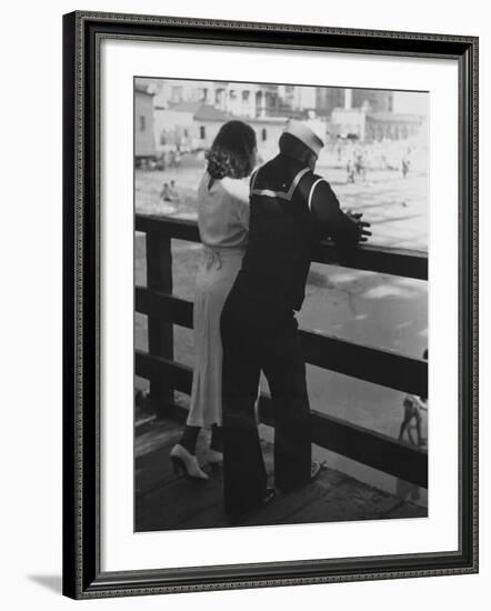 Sailor on Shore Leave Standing on Pier with a Young Woman-Peter Stackpole-Framed Photographic Print