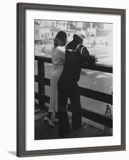 Sailor on Shore Leave Standing on Pier with a Young Woman-Peter Stackpole-Framed Photographic Print