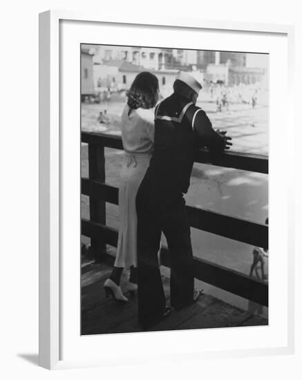 Sailor on Shore Leave Standing on Pier with a Young Woman-Peter Stackpole-Framed Photographic Print