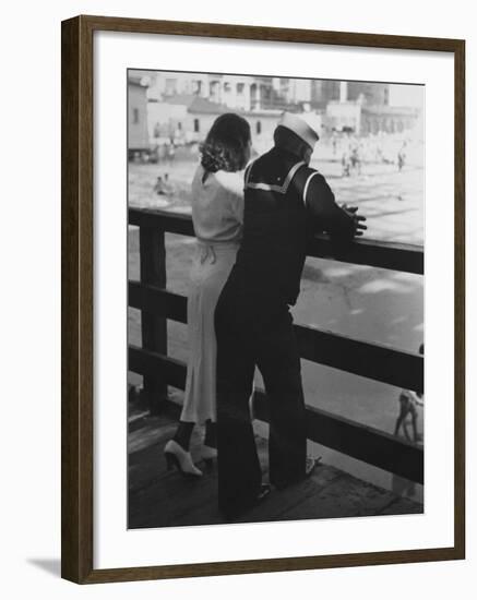 Sailor on Shore Leave Standing on Pier with a Young Woman-Peter Stackpole-Framed Photographic Print