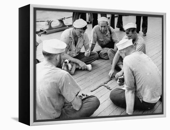 Sailors Aboard a Us Navy Cruiser at Sea Playing a Game of Dominoes on Deck During WWII-Ralph Morse-Framed Premier Image Canvas