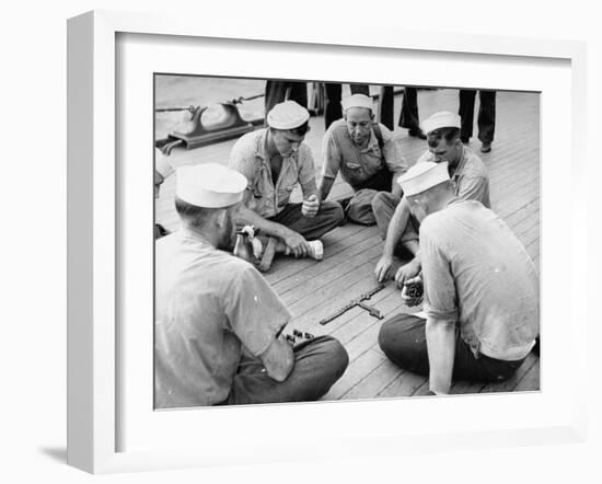 Sailors Aboard a Us Navy Cruiser at Sea Playing a Game of Dominoes on Deck During WWII-Ralph Morse-Framed Photographic Print