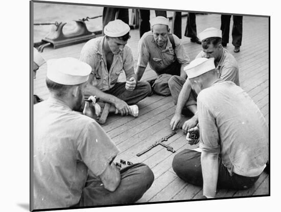 Sailors Aboard a Us Navy Cruiser at Sea Playing a Game of Dominoes on Deck During WWII-Ralph Morse-Mounted Photographic Print