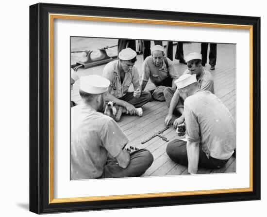 Sailors Aboard a Us Navy Cruiser at Sea Playing a Game of Dominoes on Deck During WWII-Ralph Morse-Framed Photographic Print