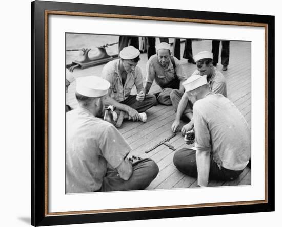 Sailors Aboard a Us Navy Cruiser at Sea Playing a Game of Dominoes on Deck During WWII-Ralph Morse-Framed Photographic Print