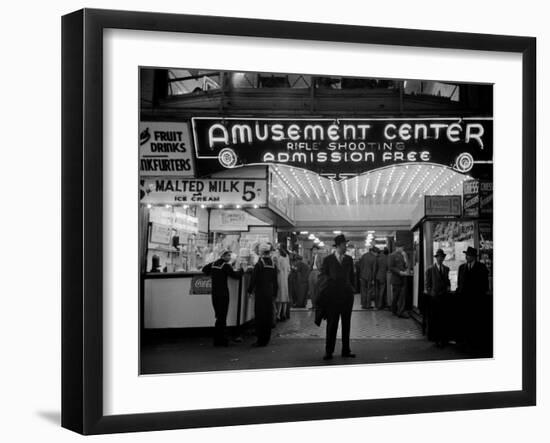 Sailors and Civilians Outside a Brightly Lit Times Square Arcade During WWII-Peter Stackpole-Framed Photographic Print