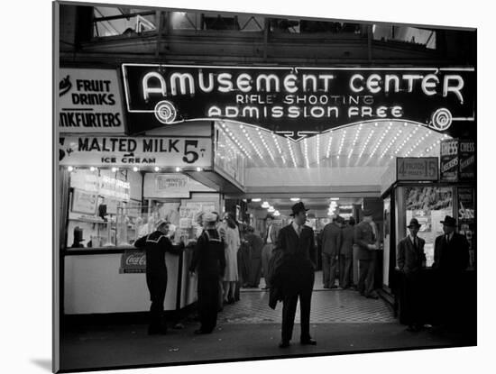 Sailors and Civilians Outside a Brightly Lit Times Square Arcade During WWII-Peter Stackpole-Mounted Photographic Print