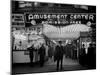 Sailors and Civilians Outside a Brightly Lit Times Square Arcade During WWII-Peter Stackpole-Mounted Photographic Print