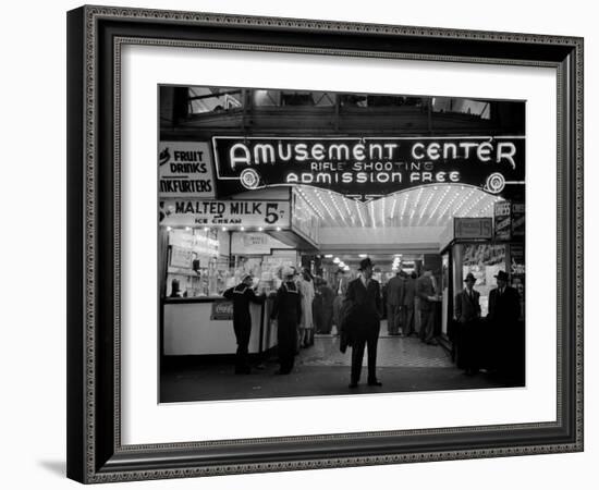 Sailors and Civilians Outside a Brightly Lit Times Square Arcade During WWII-Peter Stackpole-Framed Photographic Print