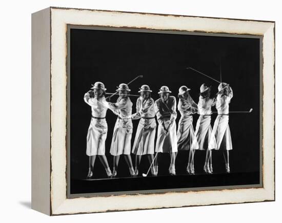 Saks Fifth Avenue Fashion Shot of Model Swinging Golf Club-Gjon Mili-Framed Premier Image Canvas