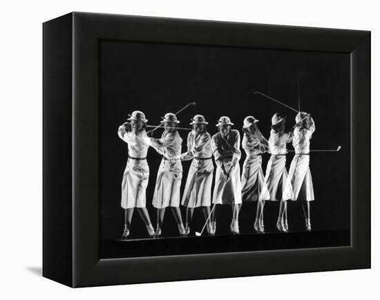 Saks Fifth Avenue Fashion Shot of Model Swinging Golf Club-Gjon Mili-Framed Premier Image Canvas