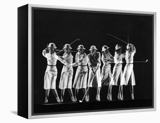 Saks Fifth Avenue Fashion Shot of Model Swinging Golf Club-Gjon Mili-Framed Premier Image Canvas