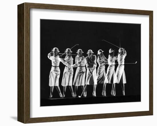 Saks Fifth Avenue Fashion Shot of Model Swinging Golf Club-Gjon Mili-Framed Photographic Print