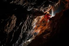 Spelunkers Exploring an Underground Cave River-salajean-Photographic Print